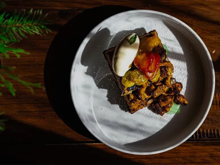 Honey cake toast with mascarpone, seasonal fruit and mint. Client-provided photography.